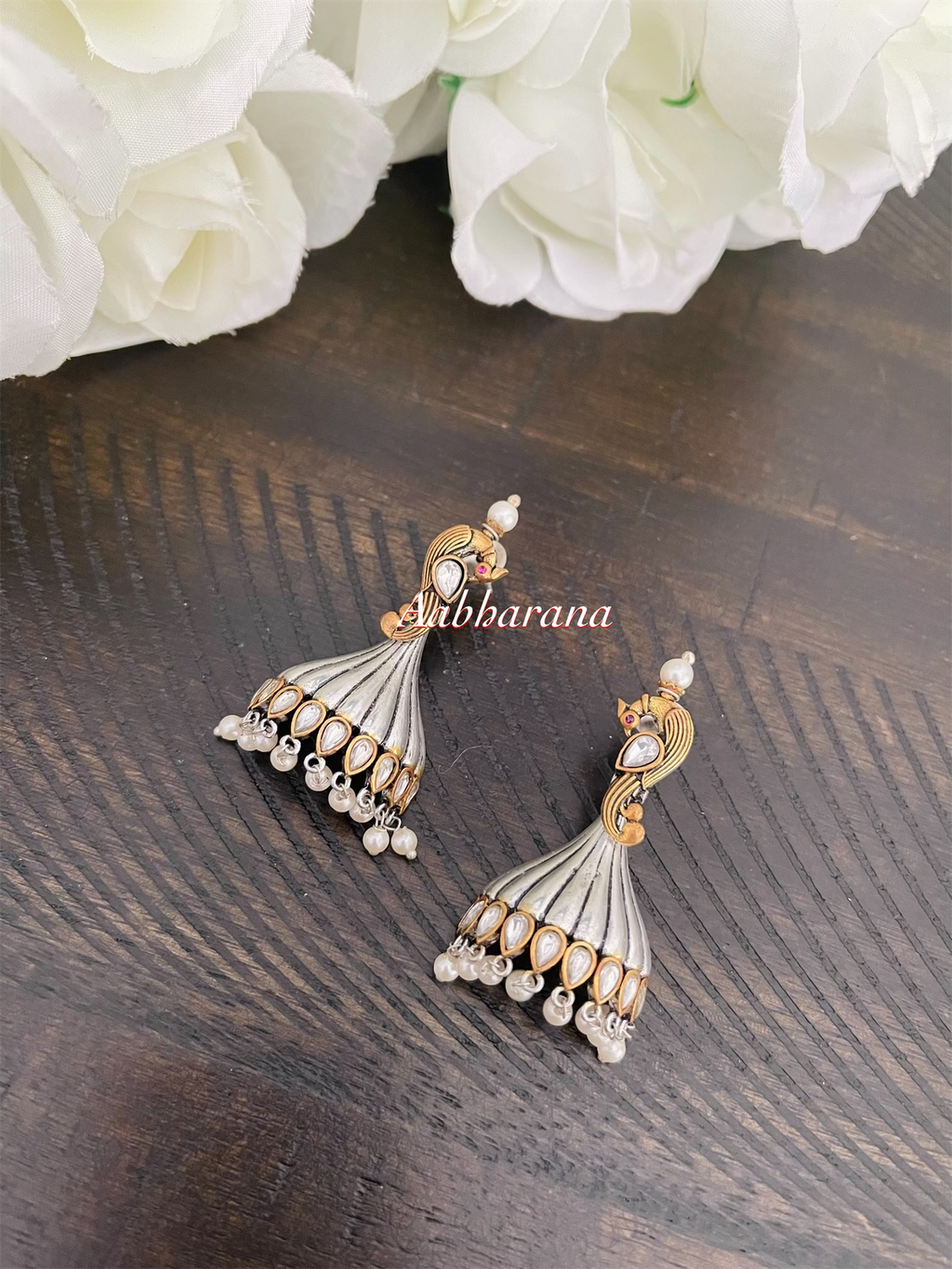 Kundan peacock jumka earrings