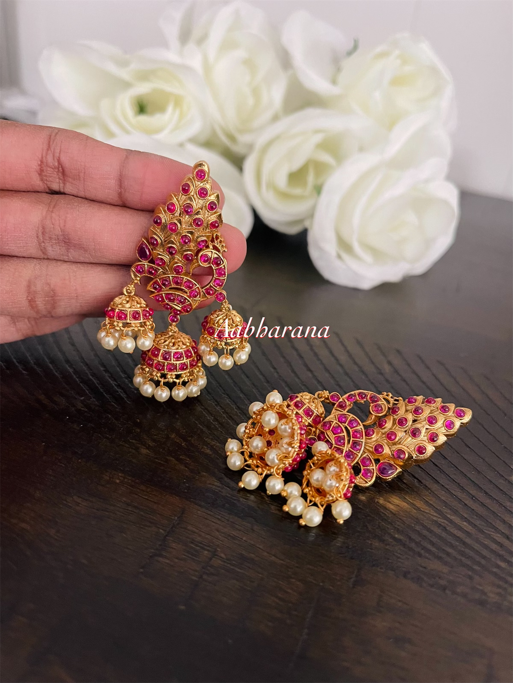 Imitation kemp peacock jumka earrings