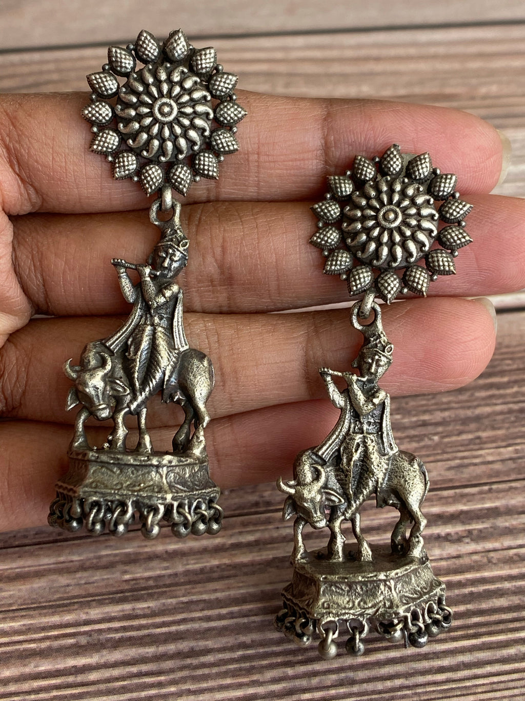 German silver Krishna earrings